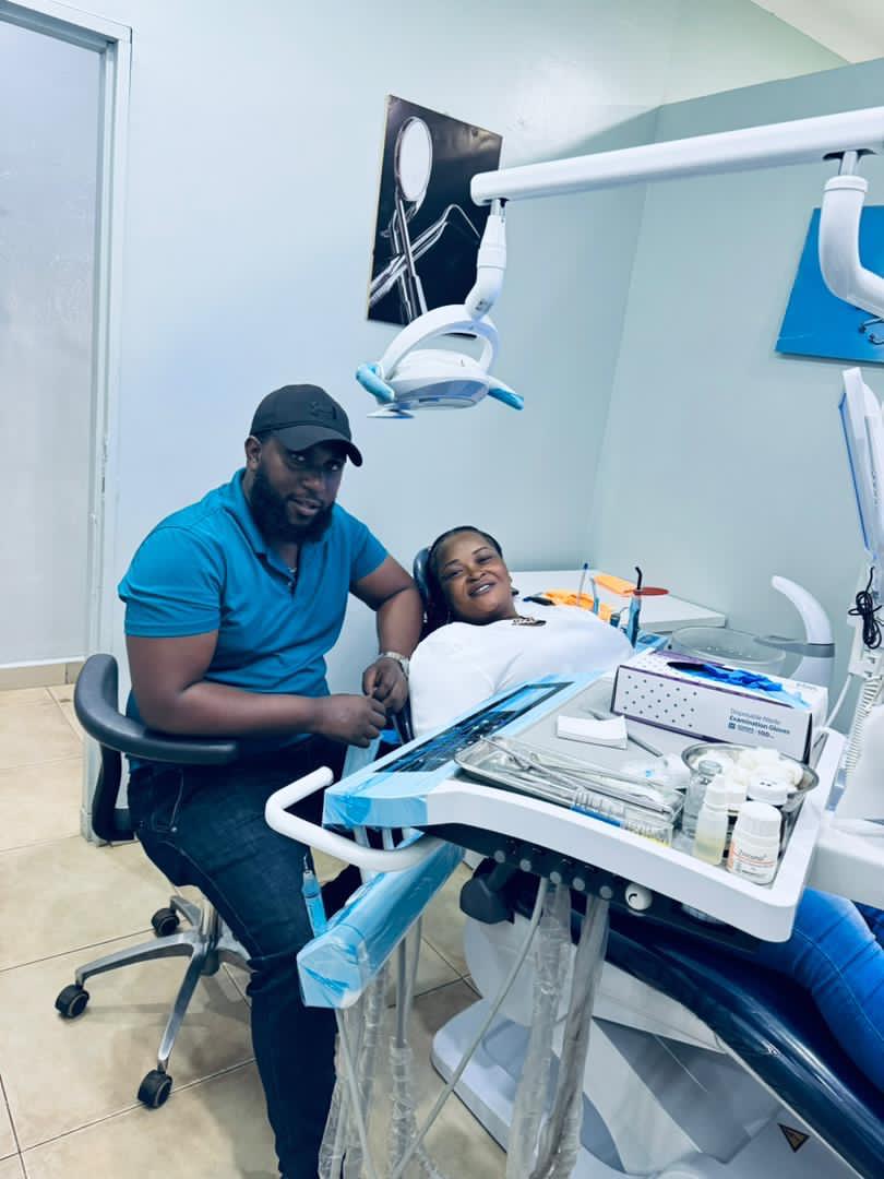 Dr. Mzalendo La-Bouche with a patient at La Bouche Dental Clinic in Wandegeya Kampala